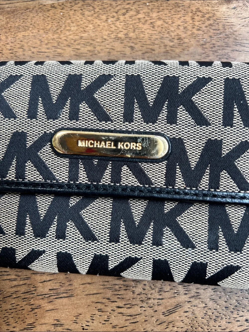 Michael Kors Black and Tan Logo Foldover Wallet with Gold Plaque